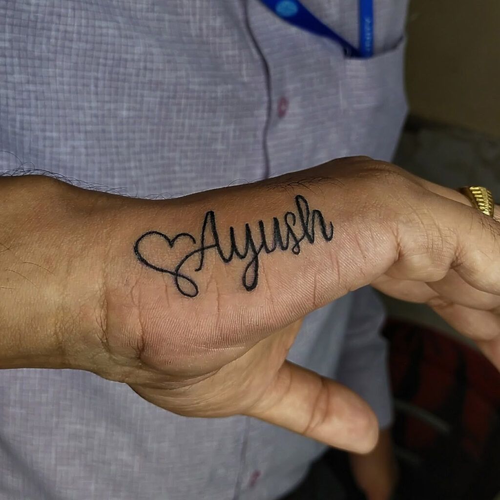 name tattoo with heart